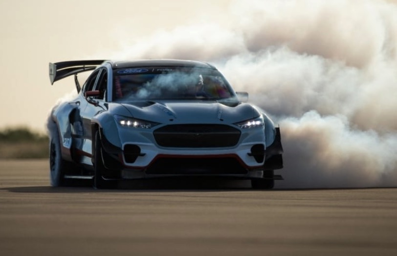 Ford Mustang Mach-E 1400 burning out its tires on a race track