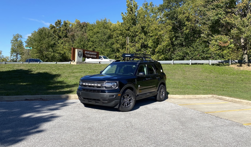 a Ford Bronco parked in the back of the dealership lot